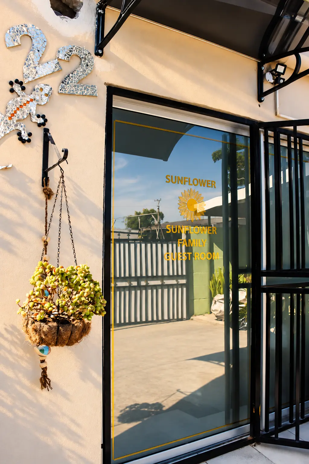 Sunflower Family Guest Room entrance door with mosaic number 22