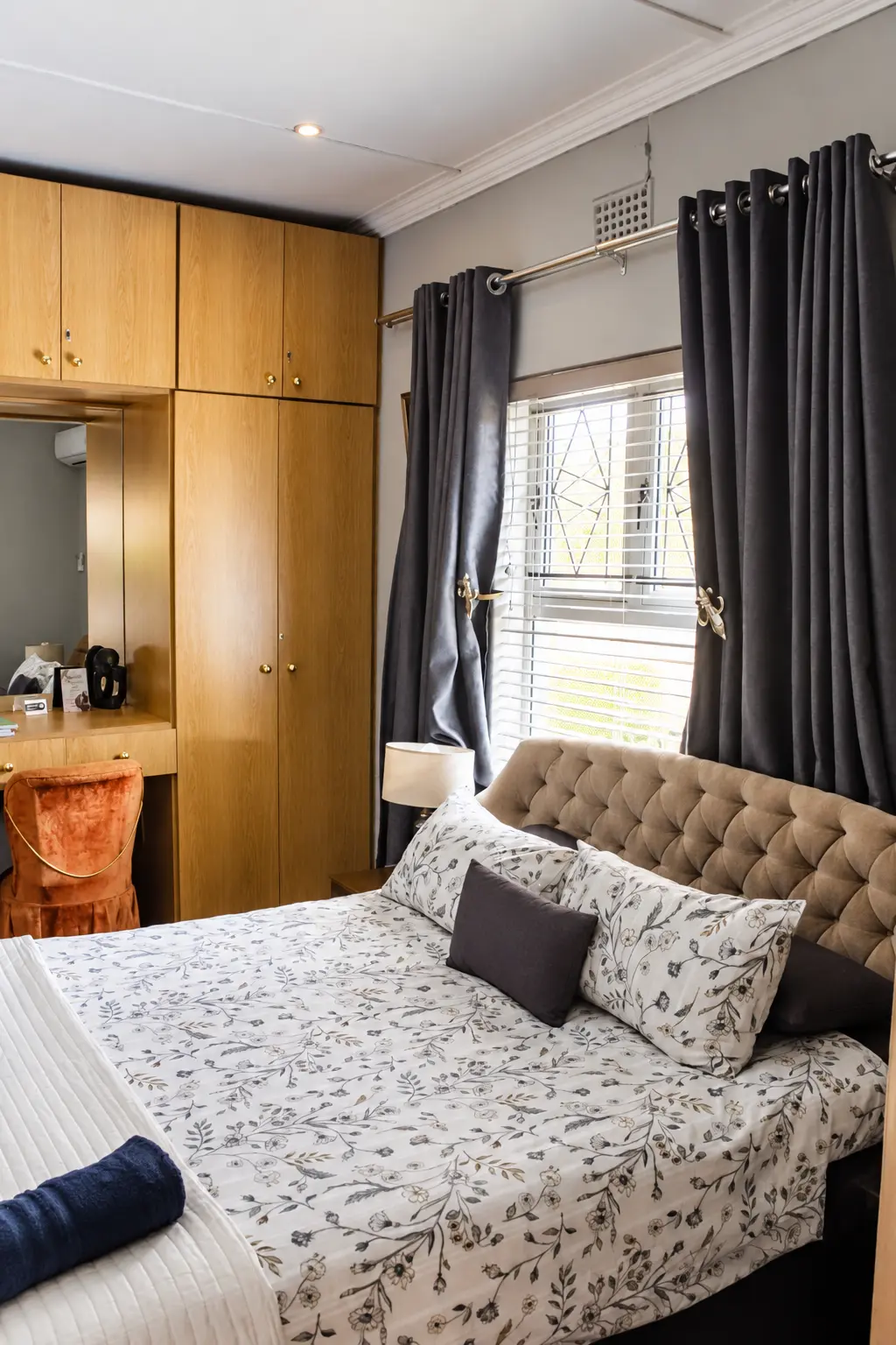 Aloe room bed with tufted headboard and built-in wardrobes