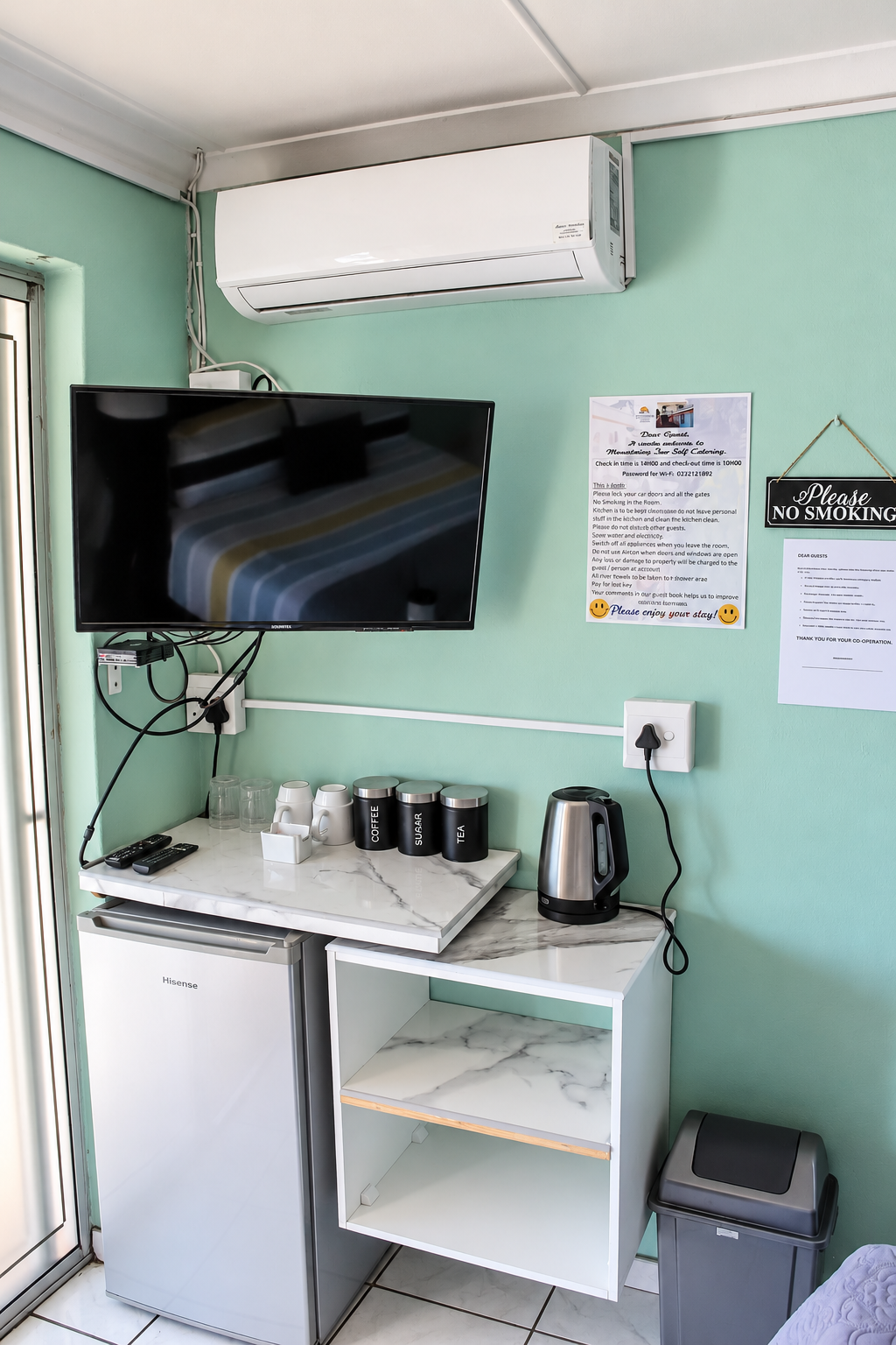 Rose room kitchenette with TV and bar fridge